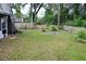 Large backyard with beautiful green grass and a wooden fence offers plenty of space at 855 Sugar House Dr, Port Orange, FL 32129