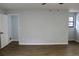 Bedroom featuring wood-look flooring, fresh paint, and a ceiling fan at 855 Sugar House Dr, Port Orange, FL 32129