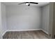Neutral bedroom featuring tile floors, a ceiling fan and fresh paint at 855 Sugar House Dr, Port Orange, FL 32129