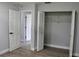 Bedroom featuring wood-look tile flooring, a closet, and fresh paint at 855 Sugar House Dr, Port Orange, FL 32129