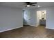 A light and airy bedroom offering wood-look floors and en-suite bathroom at 855 Sugar House Dr, Port Orange, FL 32129