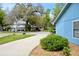 Wide driveway and lush greenery enhance this cozy home at 855 Sugar House Dr, Port Orange, FL 32129