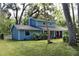 Charming home with mature trees, lush landscaping, and covered porch at 855 Sugar House Dr, Port Orange, FL 32129