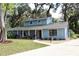 Charming home with a covered porch and well-kept lawn at 855 Sugar House Dr, Port Orange, FL 32129