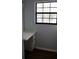 A vanity area with wood-look floors and natural light from a window at 855 Sugar House Dr, Port Orange, FL 32129