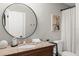 Bathroom features granite countertops, a shower/tub combo and a decorative mirror at 898 Baybreeze Way # 880, New Smyrna Beach, FL 32169