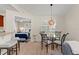 Dining area with table, chairs, and views into the bedroom; bright and open at 898 Baybreeze Way # 880, New Smyrna Beach, FL 32169