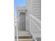 View of exterior of home, showcasing the stairs and siding at 898 Baybreeze Way # 880, New Smyrna Beach, FL 32169