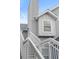 A close up of an exterior home elevation, showing stairs and a window dormer at 898 Baybreeze Way # 880, New Smyrna Beach, FL 32169