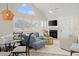 Living room with white shiplap fireplace, high ceilings and plenty of natural light at 898 Baybreeze Way # 880, New Smyrna Beach, FL 32169