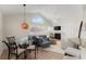 Open living space with a view of dining area and plenty of natural light from large window at 898 Baybreeze Way # 880, New Smyrna Beach, FL 32169