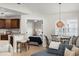 Open-concept living space with a kitchen, dining area, and views into the bedroom at 898 Baybreeze Way # 880, New Smyrna Beach, FL 32169
