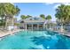 Inviting pool with a shaded lounge area and clear blue water at 898 Baybreeze Way # 880, New Smyrna Beach, FL 32169