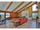 Spacious living room with vaulted ceilings, exposed beams, and ample seating at 112 Lagoon Ct, New Smyrna Beach, FL 32169