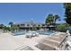Beautiful community pool with lounge chairs and shaded tables at 112 Lagoon Ct, New Smyrna Beach, FL 32169