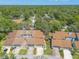 An aerial view of townhomes, each featuring private parking and lush surrounding greenery at 210 Pine Cone Trl, Ormond Beach, FL 32174