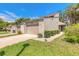 Charming townhome with a well-manicured lawn, lush landscaping, and private driveway at 210 Pine Cone Trl, Ormond Beach, FL 32174