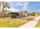 Well-maintained home with screened porch, green lawn and landscaping at 222 Brittany Ave, Port Orange, FL 32127