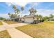 Charming home featuring an attached garage, well-maintained lawn and landscaping at 222 Brittany Ave, Port Orange, FL 32127