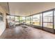 Screened-in porch with tile floors and lots of seating at 222 Brittany Ave, Port Orange, FL 32127