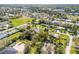 Aerial view of a residential neighborhood with sports fields and lush green trees at 312 Jefferson Ave, Port Orange, FL 32127