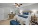 Comfortable bedroom featuring light wood floors, stylish furnishings, and plenty of natural light at 312 Jefferson Ave, Port Orange, FL 32127