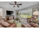 Cozy living room featuring a large window, comfortable leather seating, and stylish decor at 312 Jefferson Ave, Port Orange, FL 32127