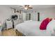 Large main bedroom featuring ceiling fan, white furnishings, and closet with curtains at 312 Jefferson Ave, Port Orange, FL 32127