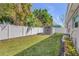 Outdoor shed surrounded by lush landscaping and a pristine, fenced backyard at 312 Jefferson Ave, Port Orange, FL 32127