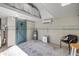 Renovated workshop with finished walls, storage, and barn door access at 312 Jefferson Ave, Port Orange, FL 32127