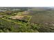 Aerial shot of a property, marked with a yellow border, near green spaces, marshland and water access at 3890 Skyway Dr, Sanford, FL 32773