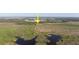 Scenic aerial view of a vast lot, accentuated with a striking yellow arrow, highlighting its location and surroundings at 3890 Skyway Dr, Sanford, FL 32773