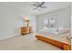 Modern bedroom with tile floors, a ceiling fan, and a large window at 465 White Cotton Cir, Oviedo, FL 32765