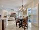 Dining area featuring a chandelier, seating, and sliding doors to a patio at 465 White Cotton Cir, Oviedo, FL 32765