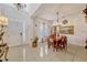 Bright dining room with tile flooring, chandelier, and large windows at 465 White Cotton Cir, Oviedo, FL 32765