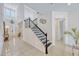 Grand entryway featuring a staircase, chandelier, and high ceilings at 465 White Cotton Cir, Oviedo, FL 32765