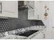 Close-up of cooktop and backsplash in the kitchen at 465 White Cotton Cir, Oviedo, FL 32765