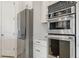 Stainless steel refrigerator and double wall ovens at 465 White Cotton Cir, Oviedo, FL 32765