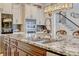 Close up view of kitchen island featuring granite countertop and modern faucet at 465 White Cotton Cir, Oviedo, FL 32765