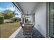 Covered patio featuring an outdoor dining set, perfect for enjoying meals with backyard views at 465 White Cotton Cir, Oviedo, FL 32765