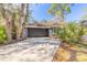 Exterior view of home showcasing a lush yard and private setting at 6205 Klondike Dr, Port Orange, FL 32127