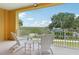 Inviting balcony showcasing a serene view, complete with seating and a table for outdoor relaxation at 7 Riverwalk Dr # 206, New Smyrna Beach, FL 32169