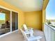 Relaxing balcony with comfortable seating, offering a perfect spot to enjoy the beautiful water view at 7 Riverwalk Dr # 206, New Smyrna Beach, FL 32169