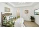 Comfortable bedroom with decorative accents, leafy green comforter and a relaxing ambiance at 7 Riverwalk Dr # 206, New Smyrna Beach, FL 32169