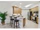 Modern kitchen with sleek countertops, stainless steel appliances, and bar-style seating at 7 Riverwalk Dr # 206, New Smyrna Beach, FL 32169