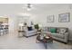 Bright living room featuring stylish furniture, neutral tones, and decorative wall art at 7 Riverwalk Dr # 206, New Smyrna Beach, FL 32169