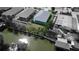 An aerial view showing the property, backyard access, and waterfront on a canal at 113 Douglas St, Edgewater, FL 32141
