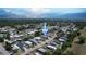 Expansive aerial view showcasing the home's location within a vibrant residential community near the waterways at 113 Douglas St, Edgewater, FL 32141