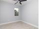 This is a bedroom with wood-look flooring, a ceiling fan and a window at 113 Douglas St, Edgewater, FL 32141