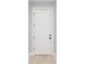 A simple, white door with black hardware at 113 Douglas St, Edgewater, FL 32141